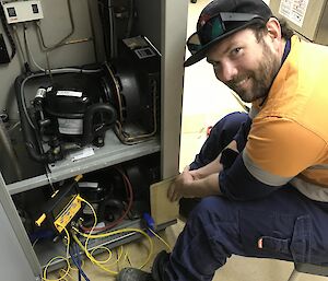 Man with lots of electrical cables.