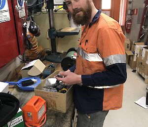 Man fixing an electrical instrument.