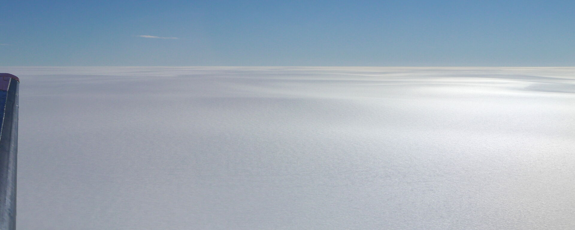 White flat expanse to the horizen with blue sky above