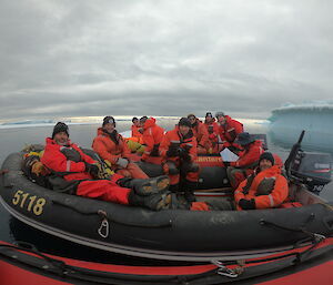 The boats pulled together, with a group of 10 expeditioners sitting in boats
