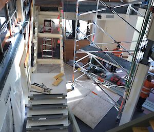 Looking down on the red shed renovations, showing the old stairs half dismantled on left and bottom right the new stairs just coming into the picture