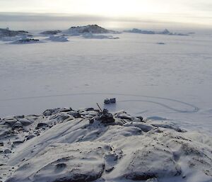 Cairn on rocky outcrop.