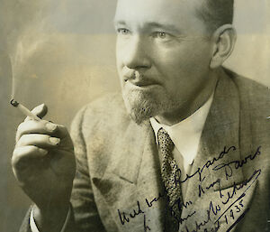 Studio portrait of man with cigarette.
