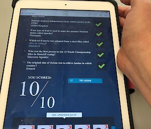 Picture of an iPad screen showing quiz questions with green ticks beside and a big 10 out of 10 at the bottom