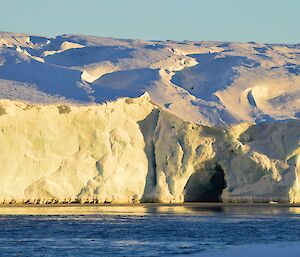 Ice cliffs at edge of glacier where it meets the water of Eyres Bay