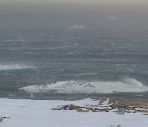 Open water that has breaking waves caused by extremely strong waves