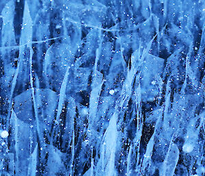 Looking down into the ice lake, showing cracks as textures in the ice