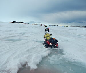 Quad bike partially sunk in melt stream