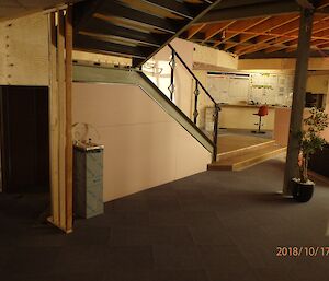 Shows new stair case, completed floor filling old void space and operations corner with whiteboards and comms consol in far corner