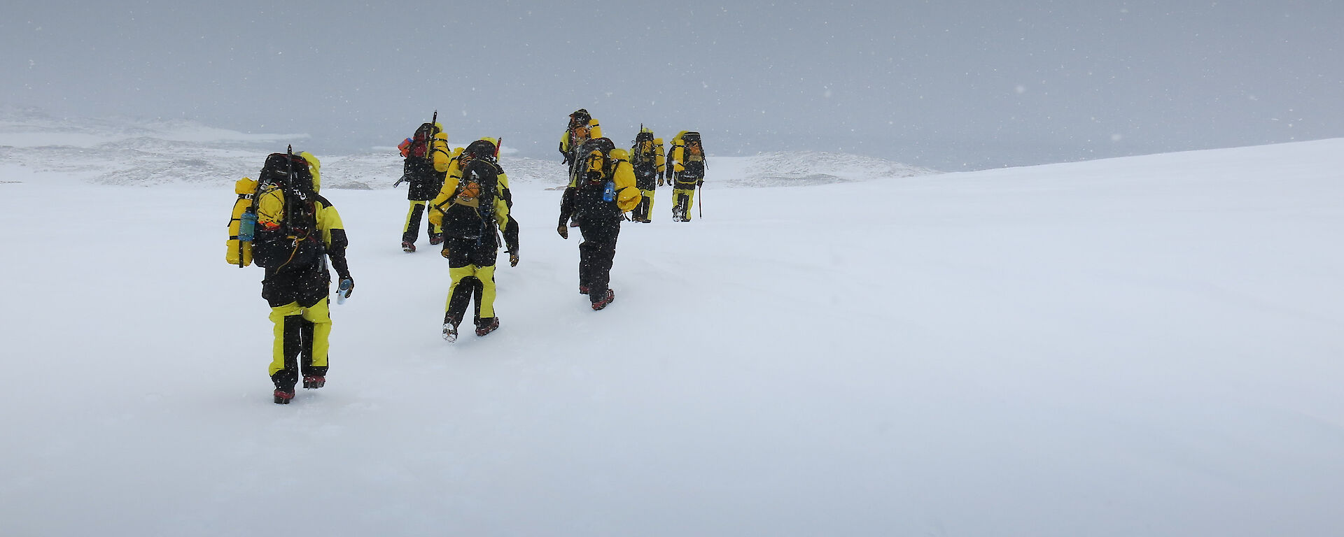 walking with our field packs over ice and snow