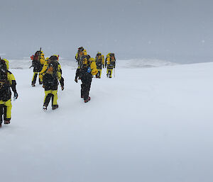 walking with our field packs over ice and snow