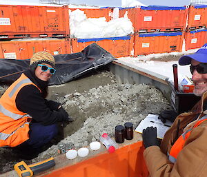 Anne and Gavin collecting soil samples from a biocell