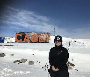 Deb in front of the Casey sign