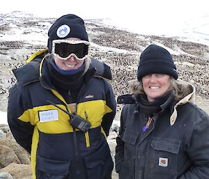 Louise and Phoebe above the penguin colony on Odbert Island take a break from their work to admire the stunning view of the expansive penguin colony