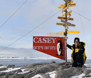 Ken and the Casey sign on a beautiful sunny day