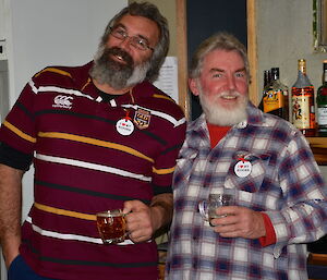 Two gentlemen enjoying a beer at the bar