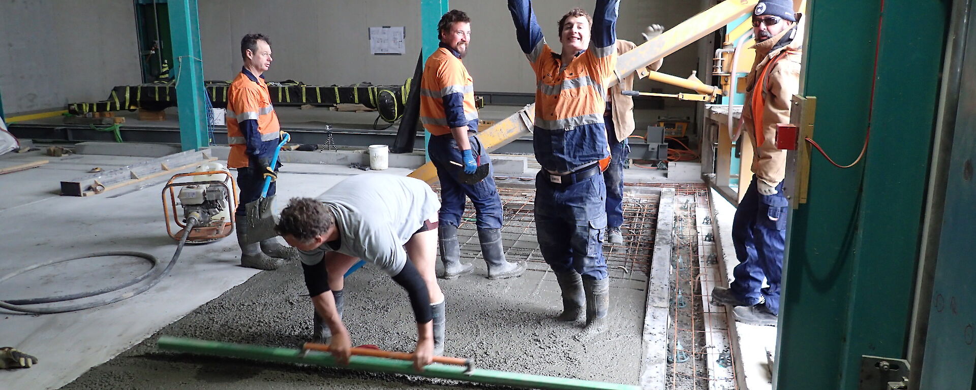 Tradesmen working on a concrete slab