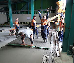 Tradesmen working on a concrete slab