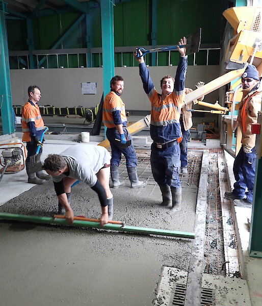 Tradesmen working on a concrete slab