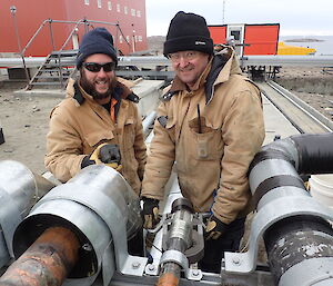 tradesmen working on fuel lines