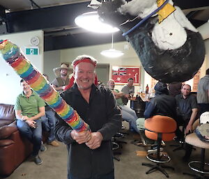 Expeditioner smiling at camera after smacking a pinata