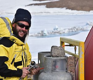 Expeditioner working on gas regulator