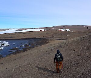 Expeditioner walking beside tide crack