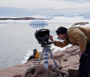 Expeditioner working on cameras