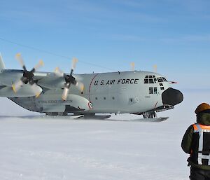 Large cargo aircraft landing at ski landing area