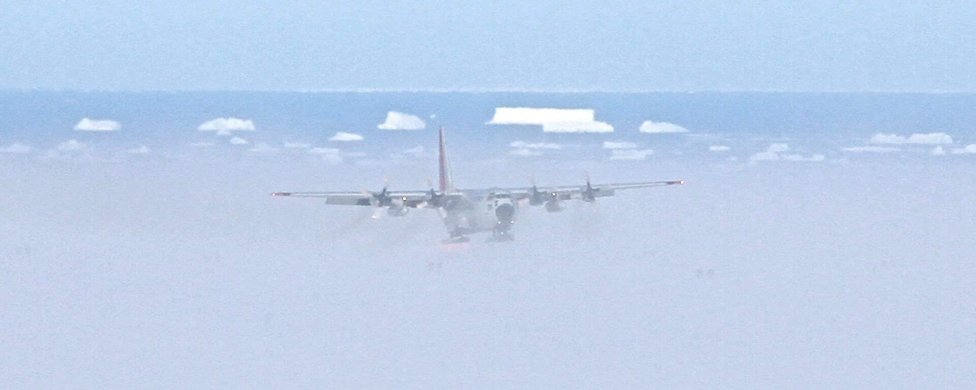 C130 Cargo Aircraft approaching to land on ice ski landing area