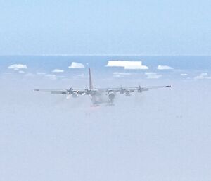 C130 Cargo Aircraft approaching to land on ice ski landing area
