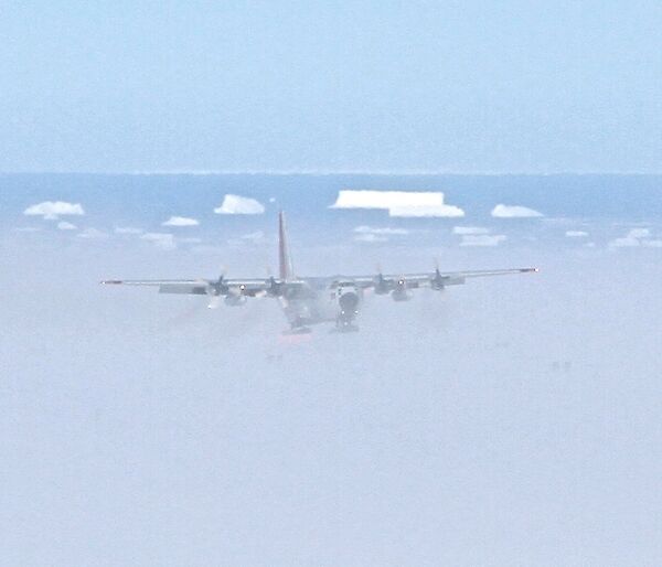 C130 Cargo Aircraft approaching to land on ice ski landing area