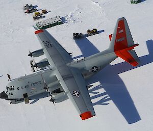 Cargo aircraft being prepared prior to take off on the ski landing strip at Davis