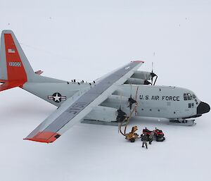 Ground crews heat engines of C130 Hercules pre-departure from ski landing area