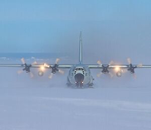 C130 cargo lift aircraft taxxiing on ice ski way