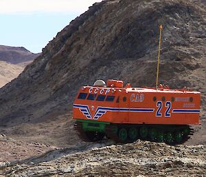 Russian tracked vehicle used for traverses sitting on rocky terrain