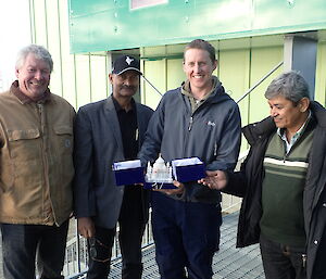 Indian and Australian expeditioners exchanging gifts at Davis
