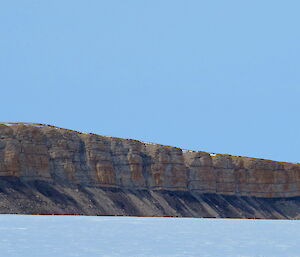 Sedimentary rock beside a large lake