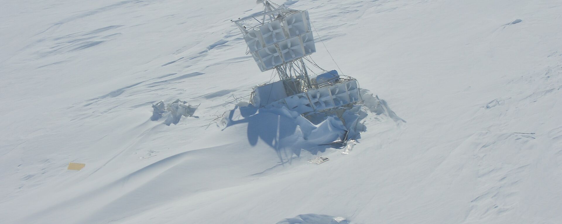 Picture of the structure of a NASA high altitude radio wave antenna embedded in snow