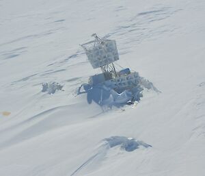Picture of the structure of a NASA high altitude radio wave antenna embedded in snow