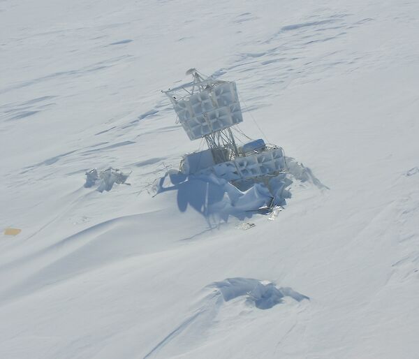 Picture of the structure of a NASA high altitude radio wave antenna embedded in snow