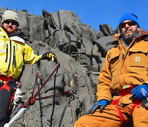 Expeditioners installing rock anchors