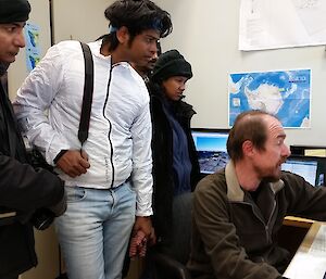 Australian expeditioner demonstrating Meteorological forecasting to visiting Indian expeditioners