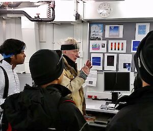 Australian scientist photographed hosting a group of Indian scientists in his laboratory