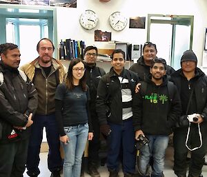 Team of Indian and Australian expeditioners facing the camera smiling