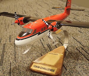 Trophy used in a distance challenge featuring a replica light plane