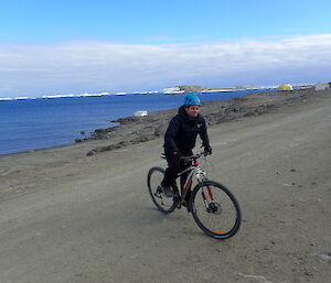 Expeditioner riding a mountain bike