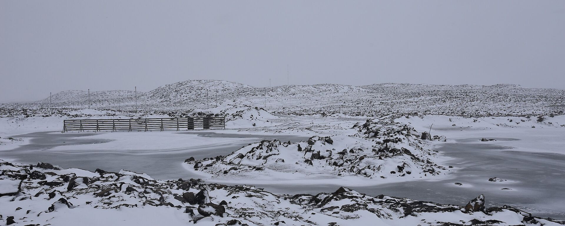 Fresh snowfall on lakes and hills surrounding the station