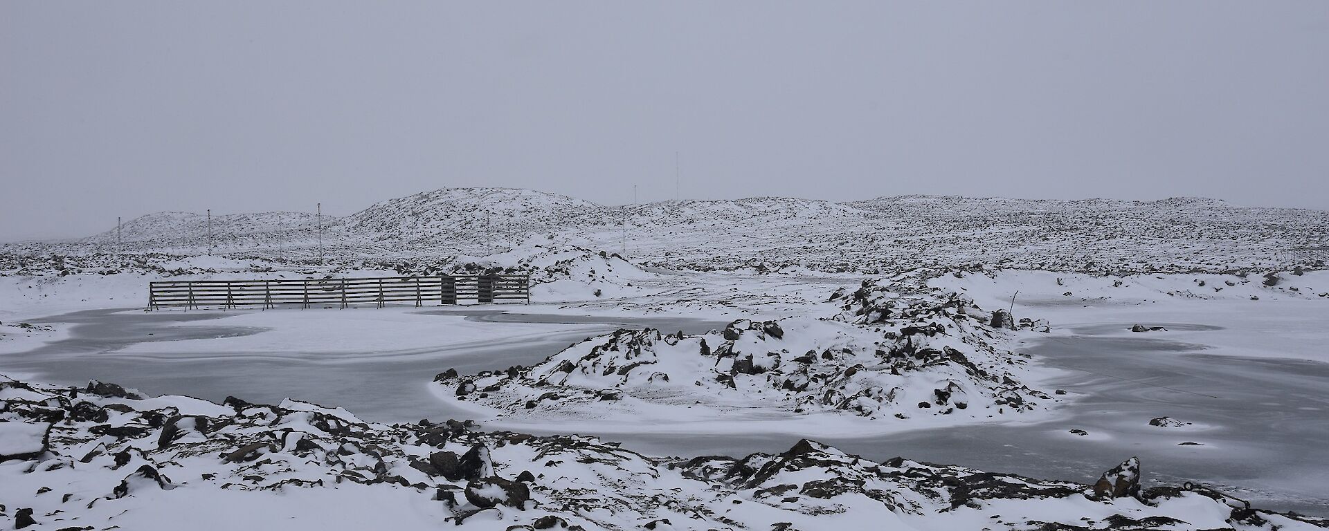 Fresh snowfall on lakes and hills surrounding the station