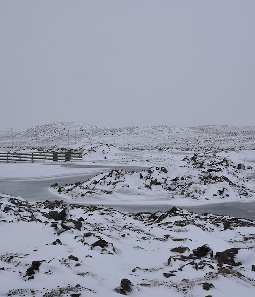Fresh snowfall on lakes and hills surrounding the station